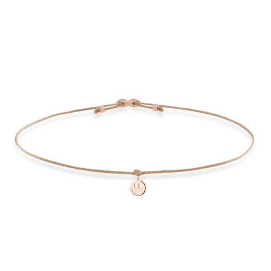 18 KT Roségold Smiley Anhänger auf beigen Stoffband